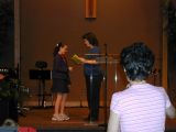 Kirstin receiving B+ Honor Roll from Miss BodeThu May 26 08:28:36 CDT 2005